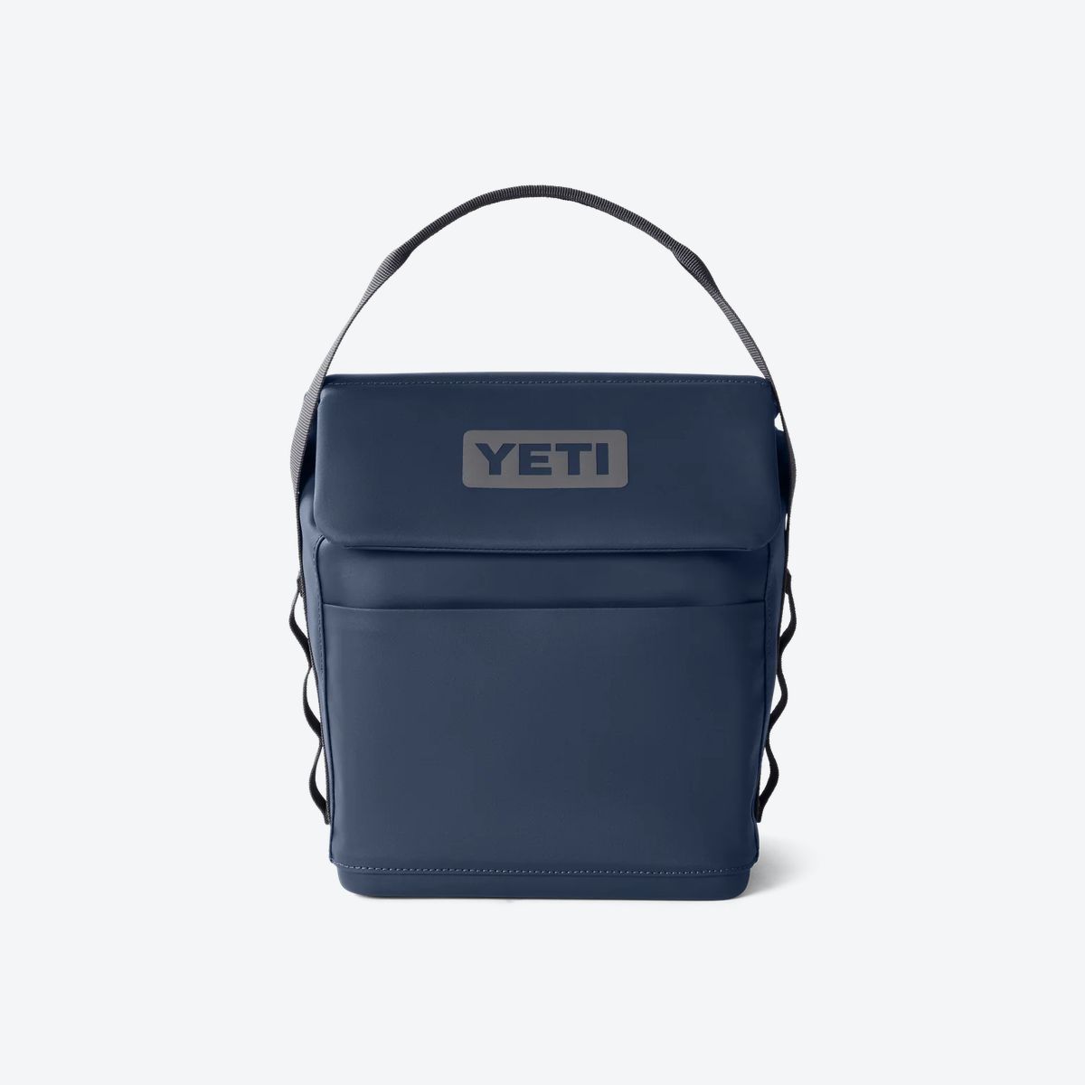 YETI Daytrip 6L Lunch Bag in Navy, front studio view showing the MagSnap flap top, carry handle, and front stash pocket